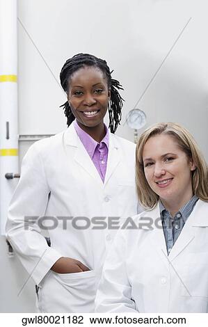 Portrait of two female doctors smiling in a laboratory View Large Photo Image Stock Image - Portrait of two female doctors smiling in a laboratory. Fotosearch