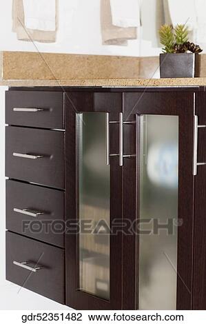 Stock Image - Potted plant on a sideboard. Fotosearch