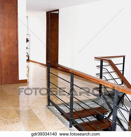 Railing of a staircase in a house View Large Photo Image Stock Image - Railing of a staircase in a house. Fotosearch
