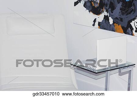 Reclining chair with a laptop View Large Photo Image Stock Image - Reclining chair with a laptop. Fotosearch