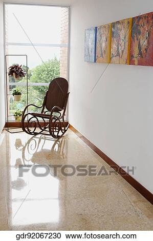 Rocking chair near a window View Large Photo Image Stock Image - Rocking chair near a window. Fotosearch