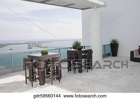 Sea viewed through the balcony of a house View Large Photo Image Picture - Sea viewed through the balcony of a house. Fotosearch