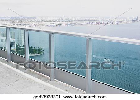 Sea viewed through the balcony of a house View Large Photo Image Stock Image - Sea viewed through the balcony of a house. Fotosearch