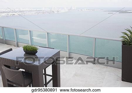 Sea viewed through the balcony of a house View Large Photo Image Stock Image - Sea viewed through the balcony of a house. Fotosearch