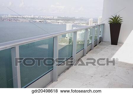 Sea viewed through the balcony of a house View Large Photo Image Stock Photo - Sea viewed through the balcony of a house. Fotosearch