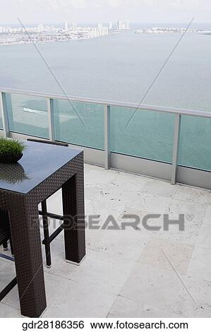 Stock Photograph - Sea viewed through the balcony of a house. Fotosearch