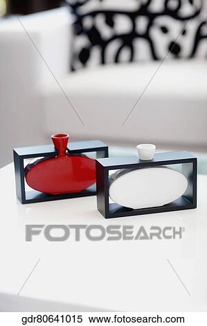 Showpieces on a table in a living room View Large Photo Image Stock Photography - Showpieces on a table in a living room. Fotosearch