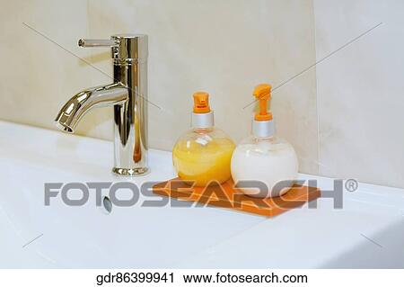 Soap dispensers on a bathroom sink View Large Photo Image Stock Image - Soap dispensers on a bathroom sink. Fotosearch