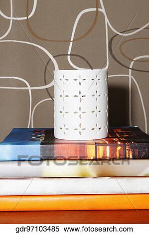 Stack of books with a pen stand View Large Photo Image Stock Photography - Stack of books with a pen stand. Fotosearch