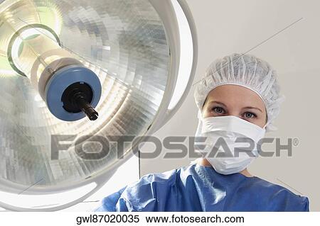 Stock Photography - Surgeon in an operating room. Fotosearch