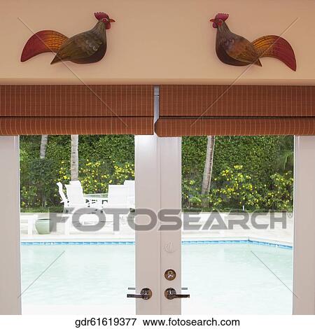 Swimming pool viewed through doors View Large Photo Image Stock Photo - Swimming pool viewed through doors. Fotosearch