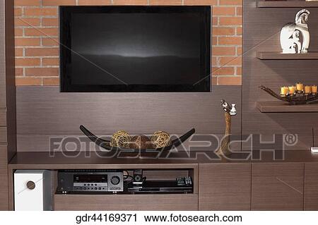 Television and a CD player on a shelf View Large Photo Image Stock Image - Television and a CD player on a shelf. Fotosearch
