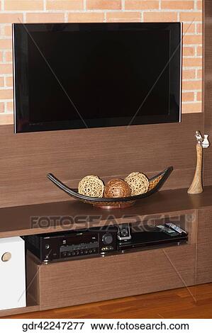 Stock Photo - Television and a CD player on a shelf. Fotosearch