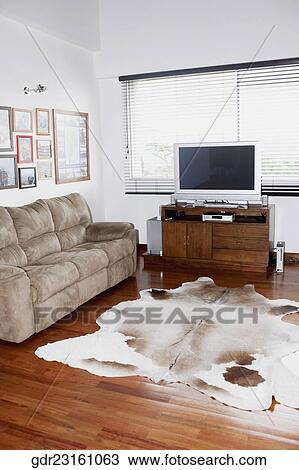 Stock Image - Television and a sofa in a living room. Fotosearch