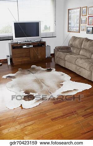 Television and a sofa in a living room View Large Photo Image Stock Photo - Television and a sofa in a living room. Fotosearch