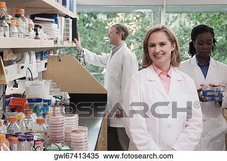 Three doctors working in a laboratory View Large Photo Image Stock Photography - Three doctors working in a laboratory. Fotosearch