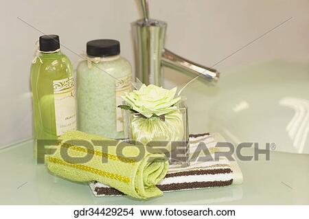 Toiletries on a bathroom sink View Large Photo Image Picture - Toiletries on a bathroom sink. Fotosearch