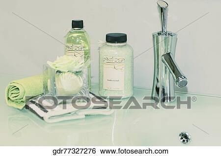 Toiletries on a bathroom sink View Large Photo Image Stock Photograph - Toiletries on a bathroom sink. Fotosearch