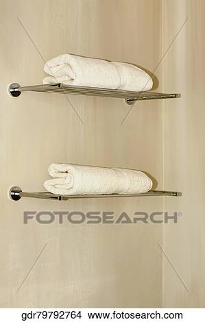 Picture - Towels on shelves in the bathroom. Fotosearch
