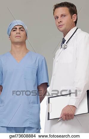 Two doctors standing together View Large Photo Image Picture - Two doctors standing together. Fotosearch