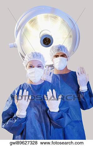Two surgeons in an operating room View Large Photo Image Stock Photo - Two surgeons in an operating room. Fotosearch