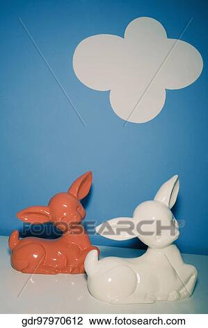 Stock Image - Two toys on a sideboard. Fotosearch