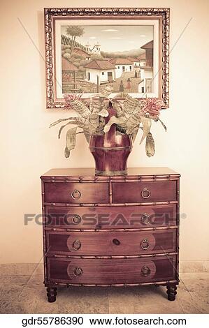 Vase on a chest View Large Photo Image Stock Image - Vase on a chest. Fotosearch