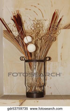 Vase with dry reed sticks View Large Photo Image Stock Photography - Vase with dry reed sticks. Fotosearch