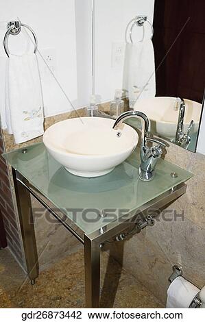 Wash bowl and a faucet in the bathroom View Large Photo Image Stock Image - Wash bowl and a faucet in the bathroom. Fotosearch