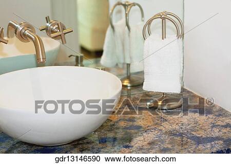 Wash bowl with a faucet in the bathroom View Large Photo Image Stock Image - Wash bowl with a faucet in the bathroom. Fotosearch
