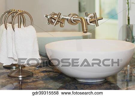 Wash bowl with towel rings in the bathroom View Large Photo Image Stock Photo - Wash bowl with towel rings in the bathroom. Fotosearch