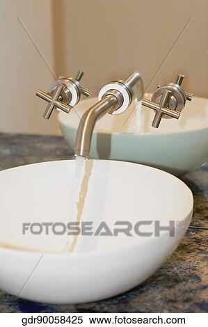Water flowing from faucet in the bathroom View Large Photo Image Stock Photography - Water flowing from faucet in the bathroom. Fotosearch