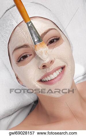 Woman applying face pack View Large Photo Image Stock Photo - Woman applying face pack. Fotosearch