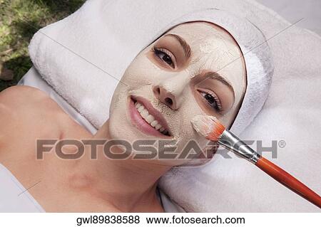 Woman applying face pack View Large Photo Image Stock Photo - Woman applying face pack. Fotosearch