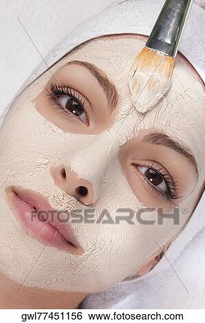 Woman applying face pack View Large Photo Image Stock Photograph - Woman applying face pack. Fotosearch