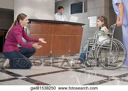 Woman assisting her daughter to walk View Large Photo Image Stock Image - Woman assisting her daughter to walk. Fotosearch
