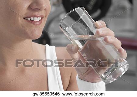 Stock Photograph - Woman drinking water. Fotosearch