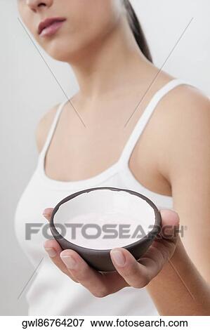 Woman holding a bowl of bath salt View Large Photo Image Stock Photo - Woman holding a bowl of bath salt. Fotosearch