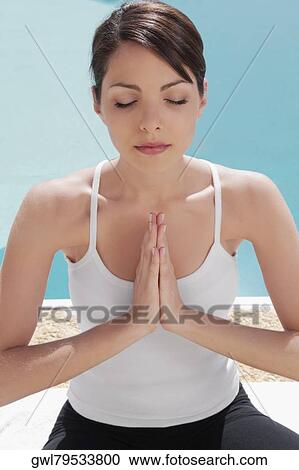 Woman practicing yoga at the poolside View Large Photo Image Stock Image - Woman practicing yoga at the poolside. Fotosearch
