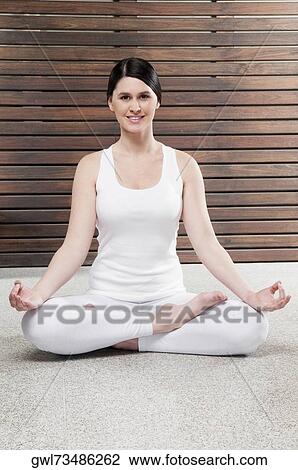 Woman practicing yoga View Large Photo Image Stock Image - Woman practicing yoga. Fotosearch