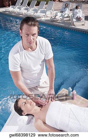 Stock Photo - Woman receiving a massage from a massage therapist. Fotosearch