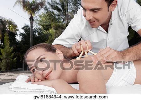 Woman receiving acupressure treatment View Large Photo Image Picture - Woman receiving acupressure treatment. Fotosearch