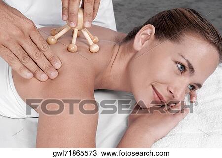 Woman receiving acupressure treatment View Large Photo Image Stock Image - Woman receiving acupressure treatment. Fotosearch