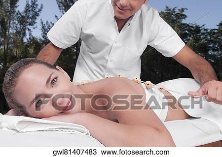 Woman receiving acupressure treatment View Large Photo Image Stock Image - Woman receiving acupressure treatment. Fotosearch