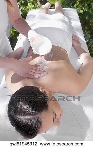 Woman receiving back massage from a massage therapist View Large Photo Image Stock Image - Woman receiving back massage from a massage therapist. Fotosearch