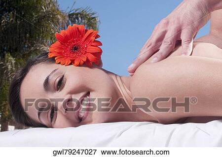 Stock Photo - Woman receiving back massage. Fotosearch