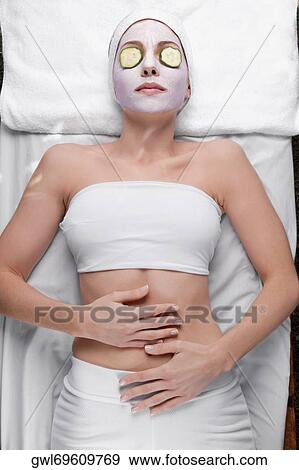 Woman receiving facial treatment View Large Photo Image Stock Photo - Woman receiving facial treatment. Fotosearch