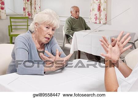 Woman receiving physical therapy in a rehabilitation center View Large Photo Image Stock Photo - Woman receiving physical therapy in a rehabilitation center. Fotosearch