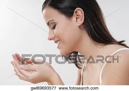 Woman smelling bath beads and smiling View Large Photo Image Stock Photo - Woman smelling bath beads and smiling. Fotosearch