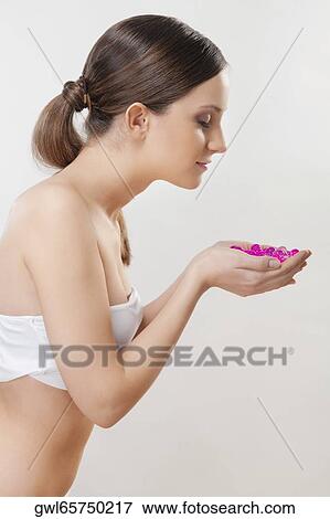 Woman smelling bath beads View Large Photo Image Stock Photo - Woman smelling bath beads. Fotosearch